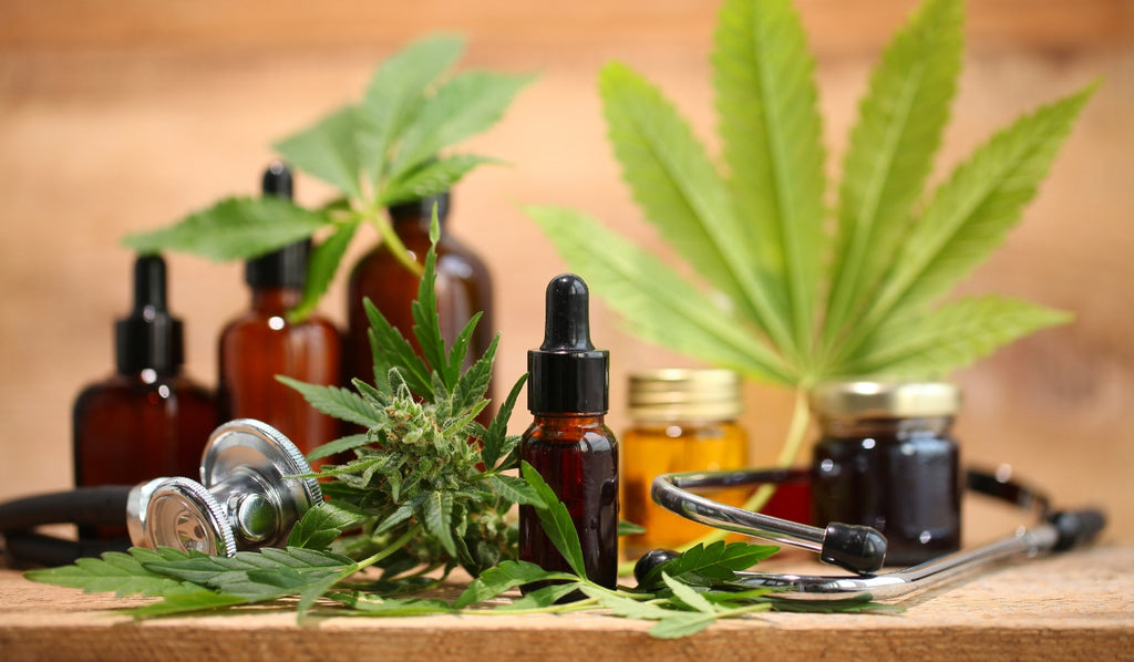 A variety of cannabis tinctures and marijuana leaves