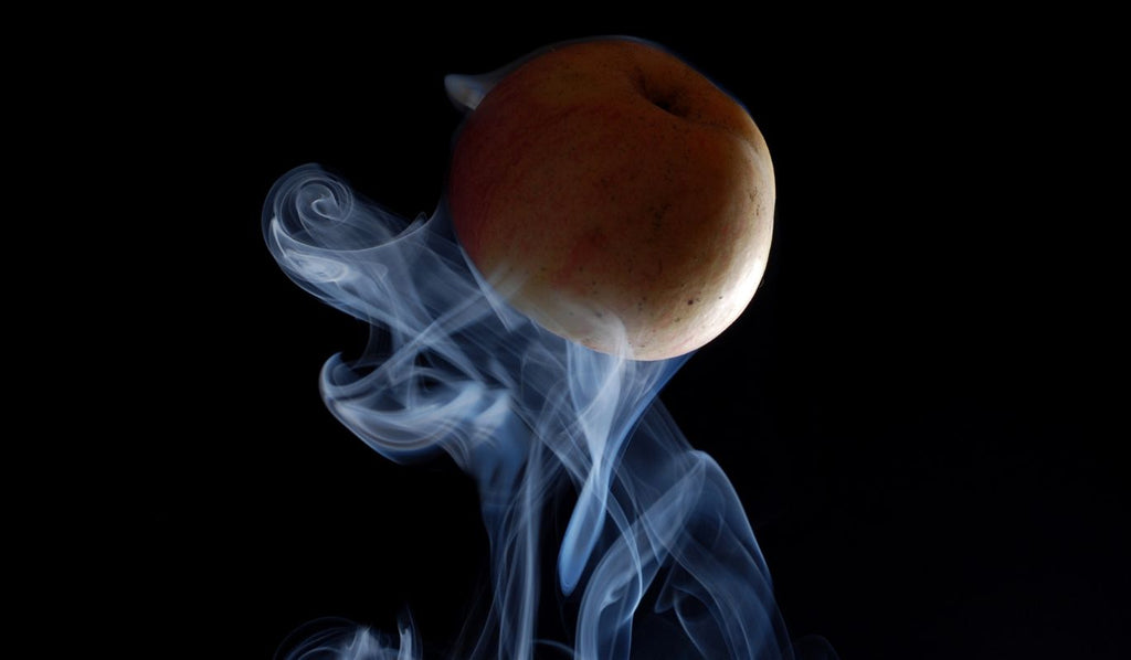 Apple amongst smoke