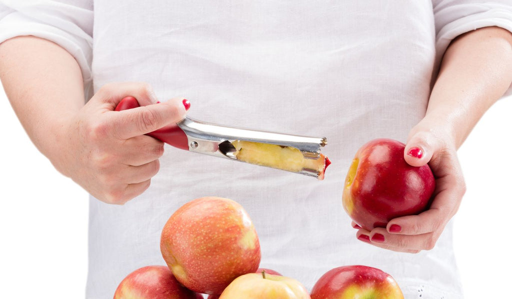 Person coring an apple